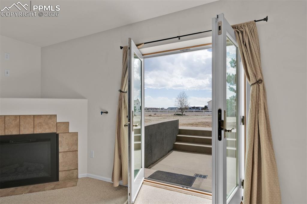 Image 40 of 49: Multi-Family Living Area with Walk-Out to the Back Yard