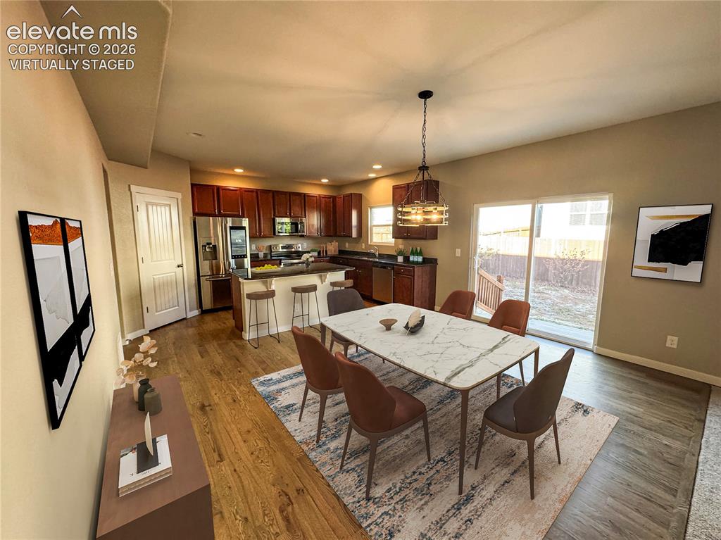 Image 10 of 42: virtually staged Kitchen featuring wood-finish cabinetry, stainless steel a