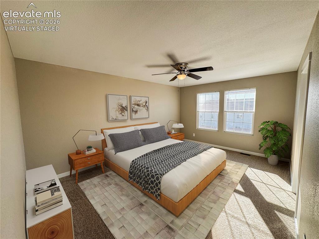 Image 30 of 42: virtually staged Neutral-toned bedroom featuring carpeted flooring, dual wi