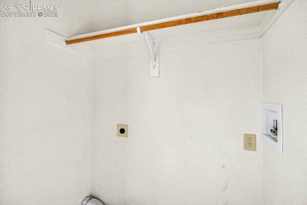 Image 8 of 26: Washroom featuring hookup for an electric dryer and hookup for a washing ma