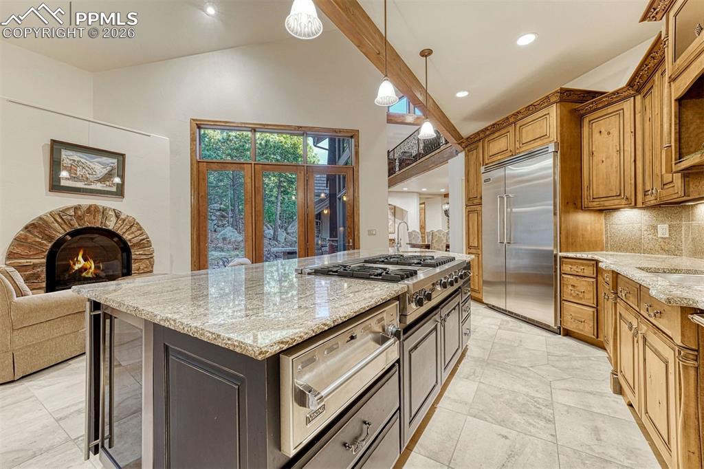 Image 10 of 50: Viking refrigerator, 6 burner stove, dual ovens and warming oven included.