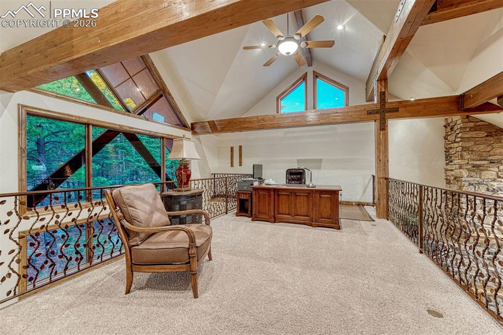 Image 19 of 50: The upper level loft provides an inspiring setting for a home office.