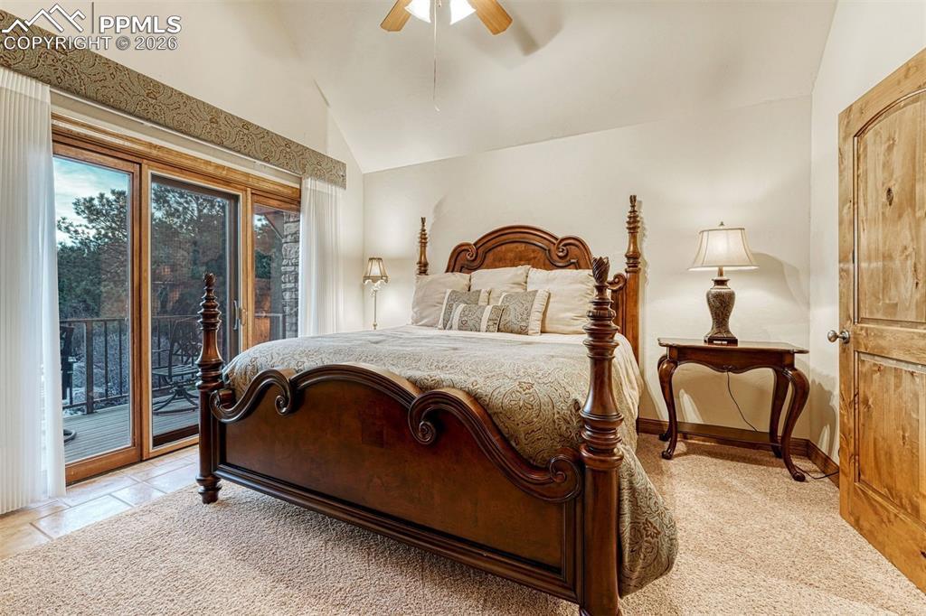 Image 20 of 50: Second upstairs bedroom with private balcony and attached bathroom.