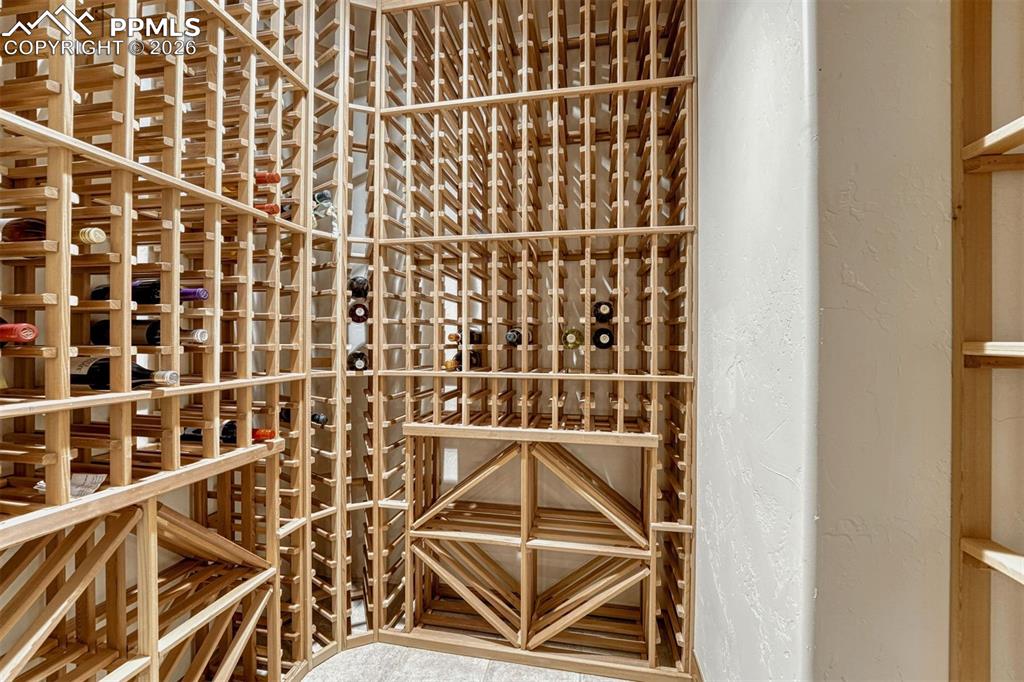 Image 25 of 50: Luxury living with a private wine cellar.