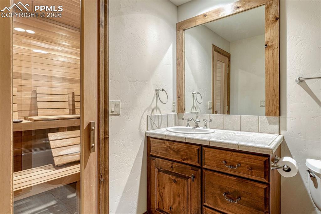Image 30 of 50: Private sauna retreat in the lower level bathroom.