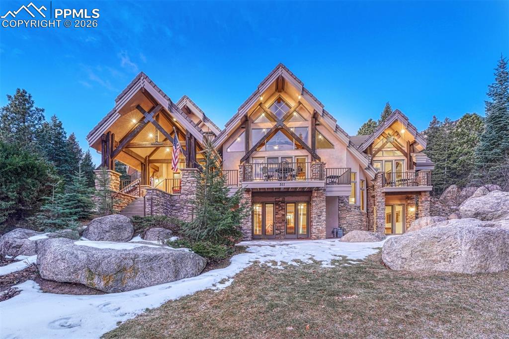 Image 35 of 50: A home that feels embraced by the landscape.