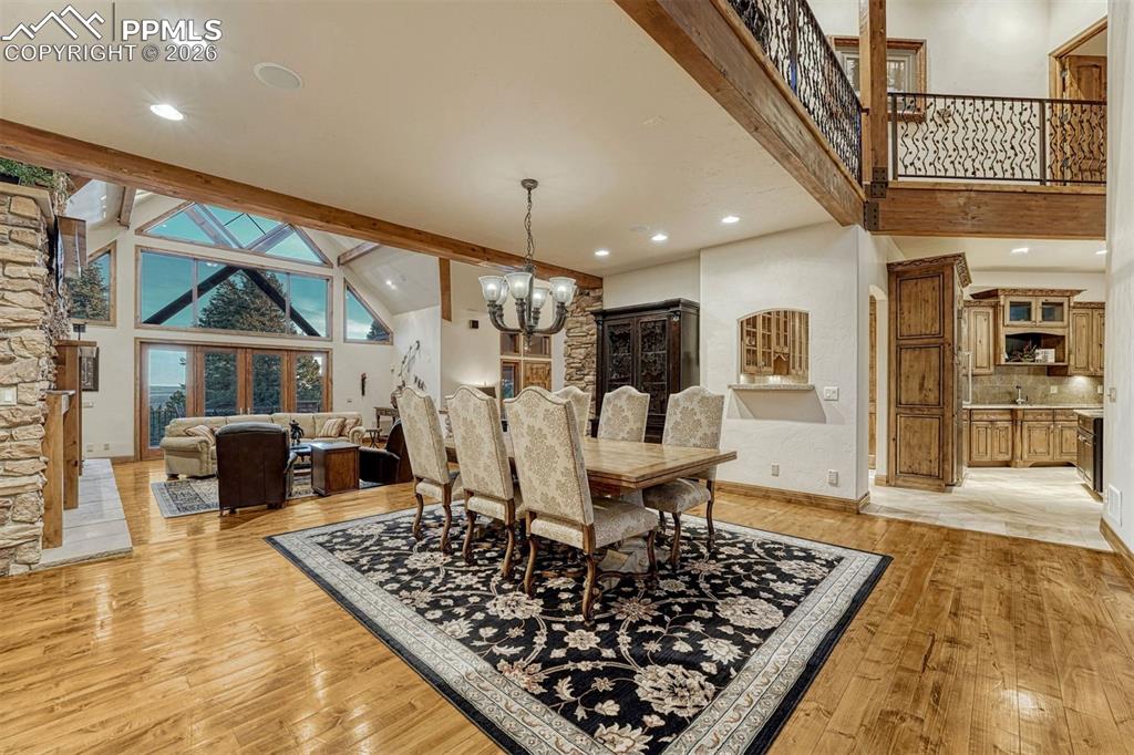 Image 42 of 50: A dedicated formal dining room seamlessly connected to the great room and k