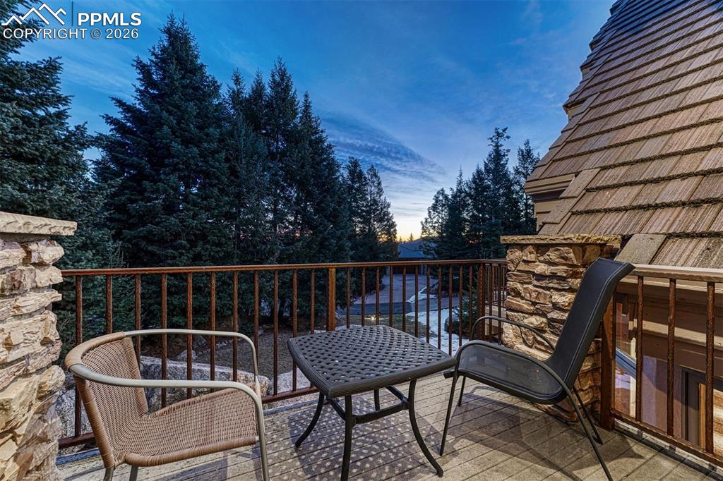 Image 8 of 50: Primary bedroom private deck.
