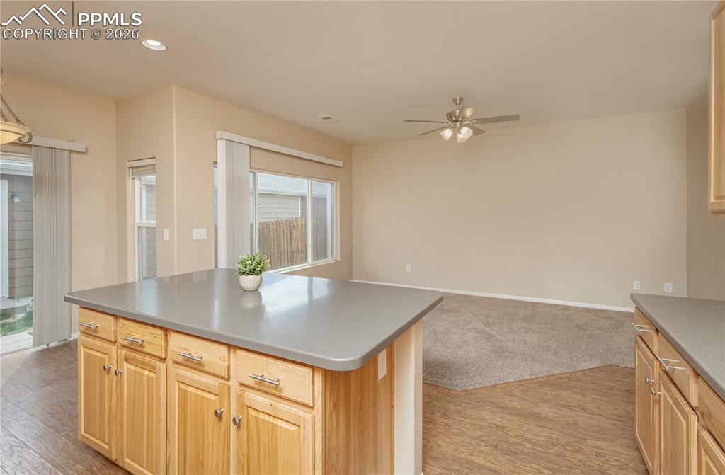 Image 26 of 33: Kitchen featuring light wood finish cabinets, light wood finished floors, a
