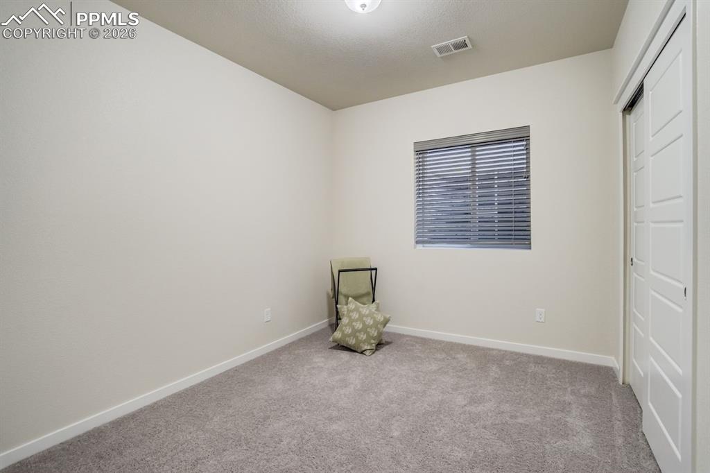 Image 30 of 39: Bedroom