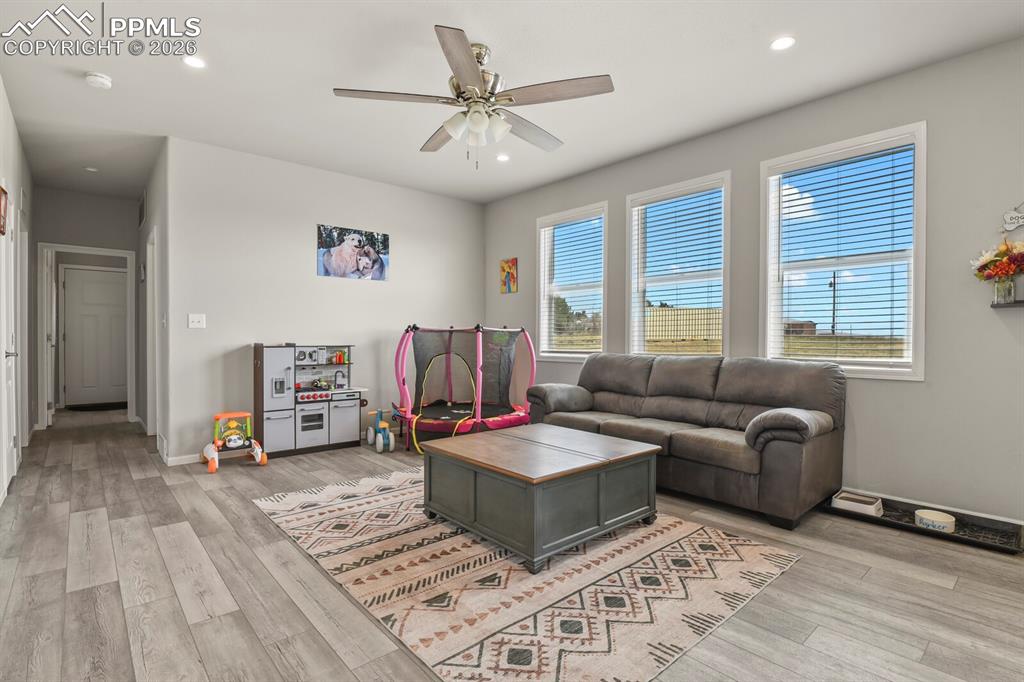 Image 15 of 48: Open concept living space featuring wood-finish flooring
