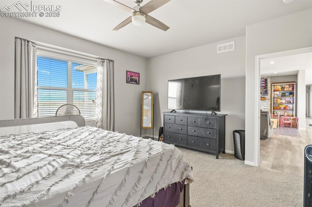 Image 18 of 48: Spacious room featuring carpeted flooring and light grey wall paint