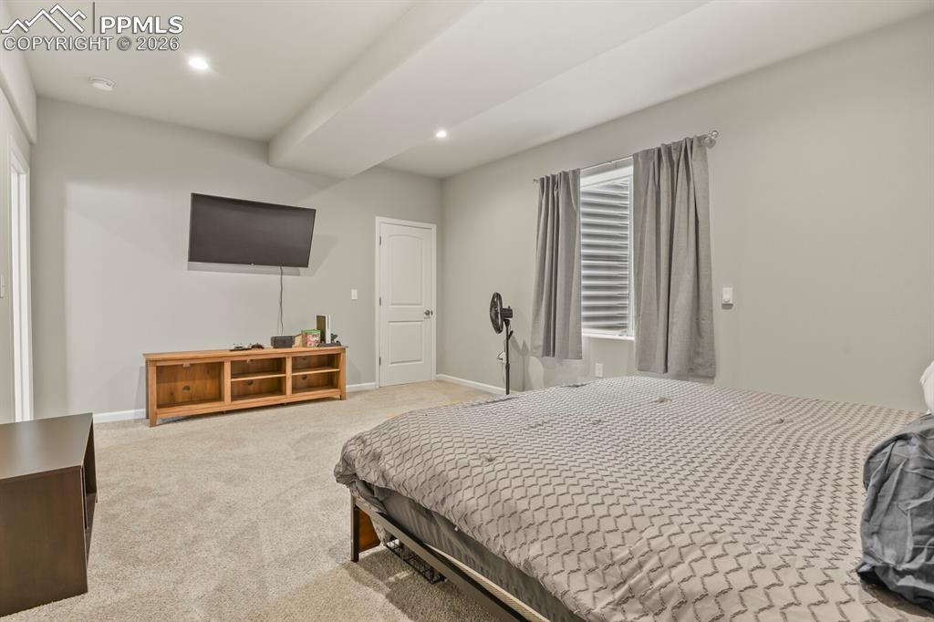 Image 32 of 48: Carpeted room with recessed lighting and light gray wall paint