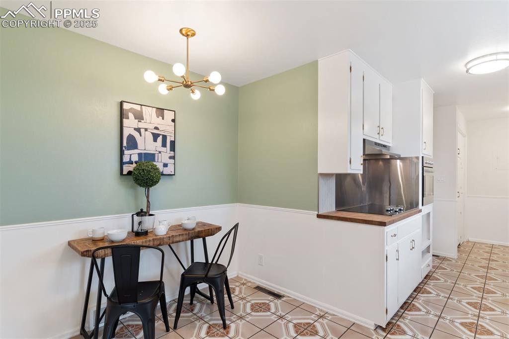 Image 21 of 37: Nook in the kitchen for a breakfast table or coffee bar.