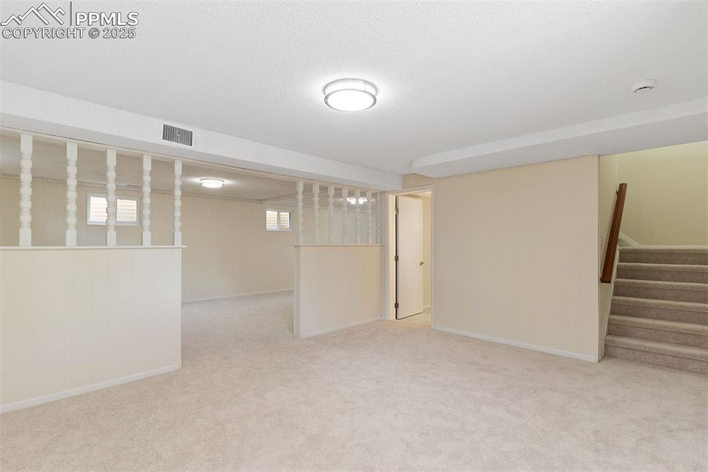 Image 23 of 37: New carpet, fresh paint and new windows.