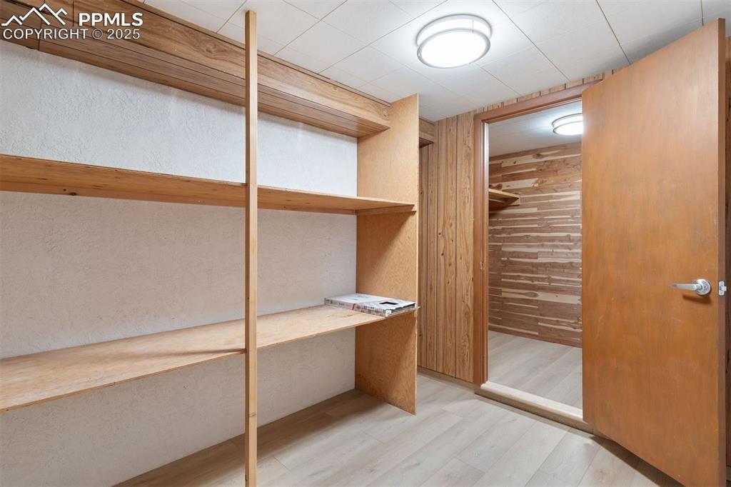 Image 30 of 37: walk in storage closet with separate Cedar lined closet.