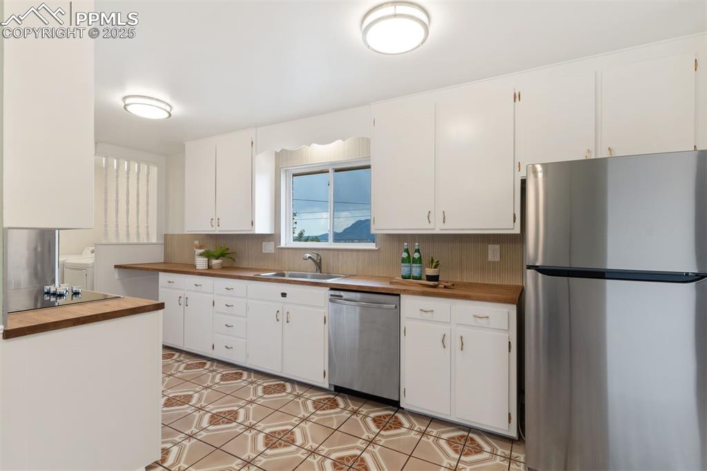 Image 6 of 37: Professionally painted cabinets made by a local Colorado Springs company wi