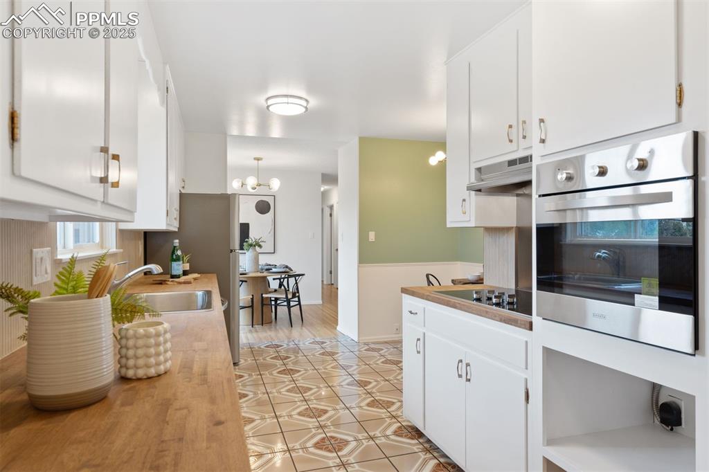 Image 9 of 37: New butcher block countertops.