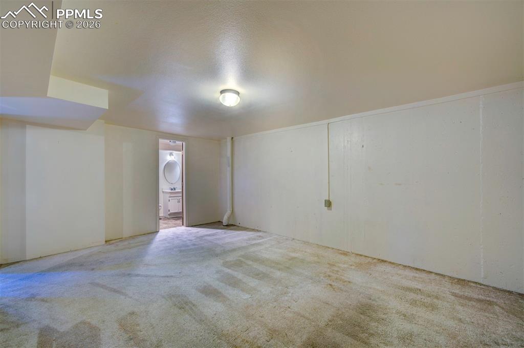 Image 31 of 40: NON-conforming bedroom in basement, with attached 3/4 bathroom