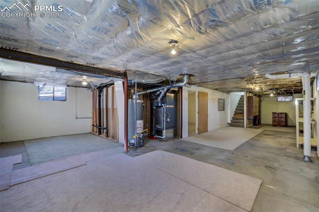 Image 34 of 40: Open area in basement. SO many possibilities
