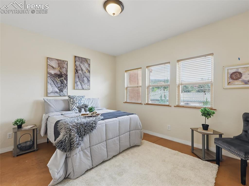 Image 13 of 41: Bedroom featuring baseboards