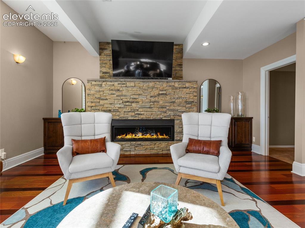 Image 12 of 33: Herringbone tile backsplash, gas range, built-in European steamer oven.
