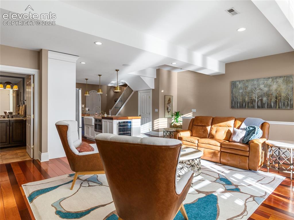 Image 13 of 33: Two-story floor-to-ceiling windows with plantation shutters and new french