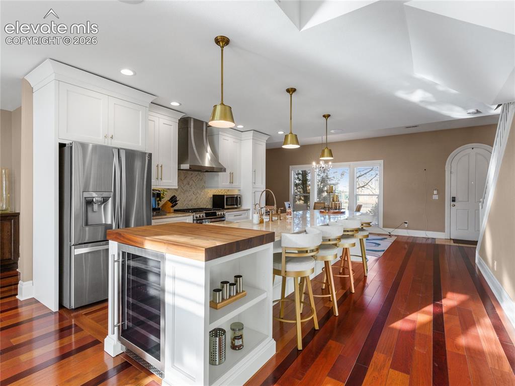Image 8 of 33: Primary suite w/double walk-in closets, updated ensuite and private balcony