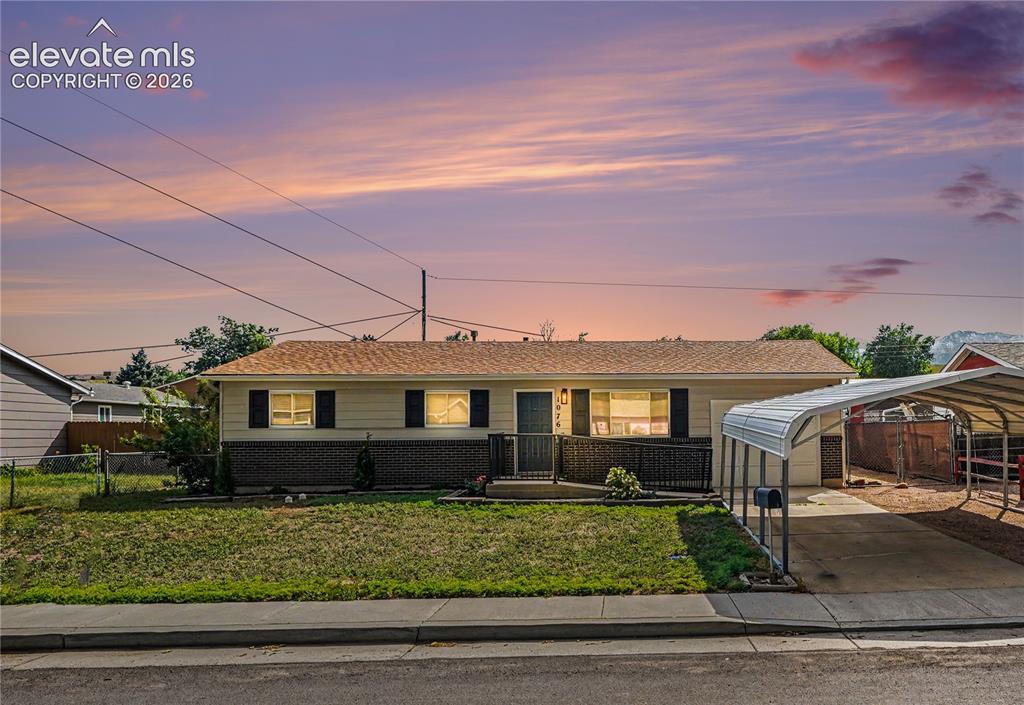 Image 1 of 22: Ranch home with 1 attached garage and a 2 space carport