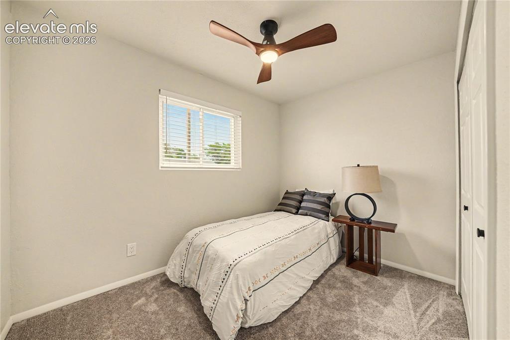 Image 10 of 18: 2nd Bedroom has new carpet, new blinds, new ceiling fan, large closet.