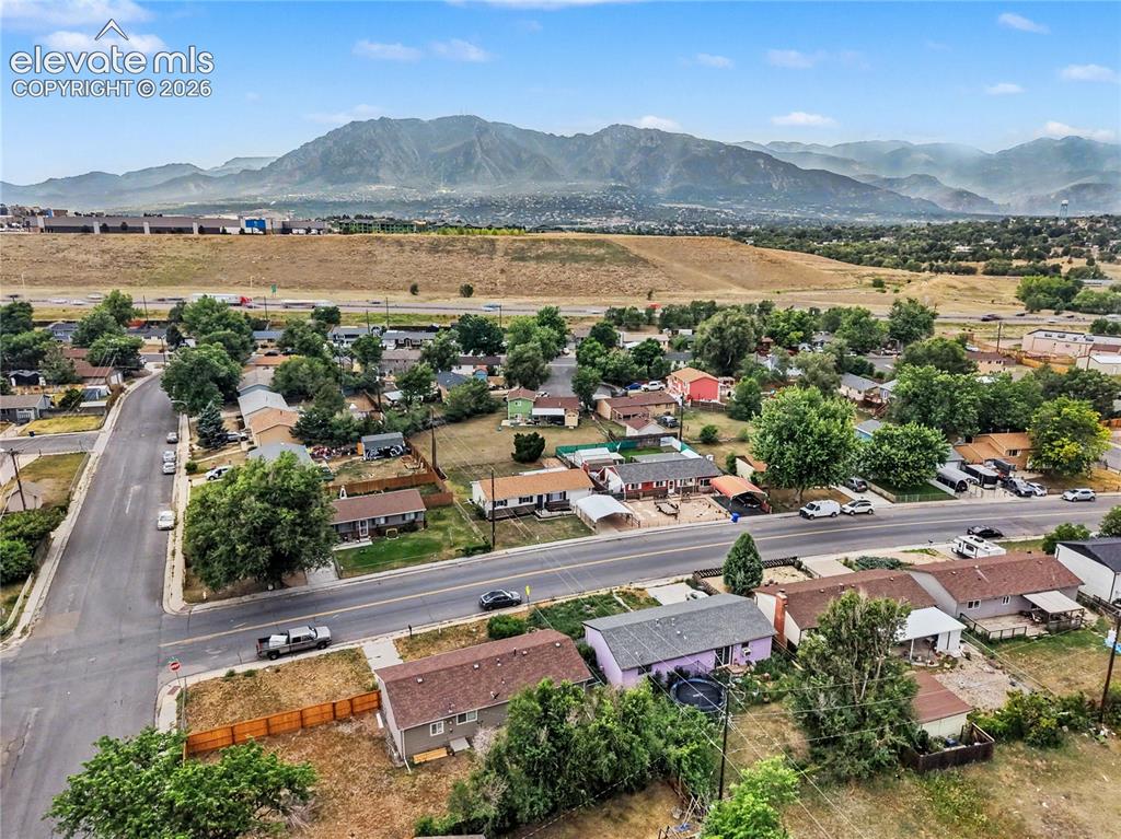 Image 18 of 18: Established residential area featuring a mix of single-story homes with a p