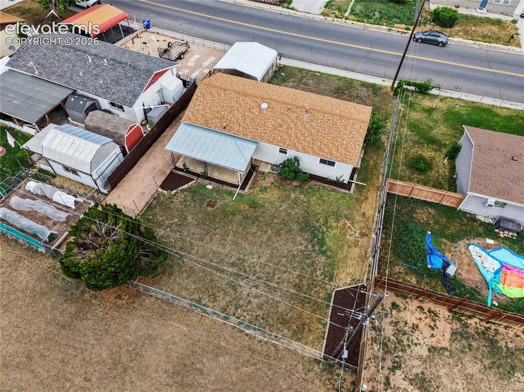 Image 20 of 22: Single-story property featuring a brown shingle roof and white siding
