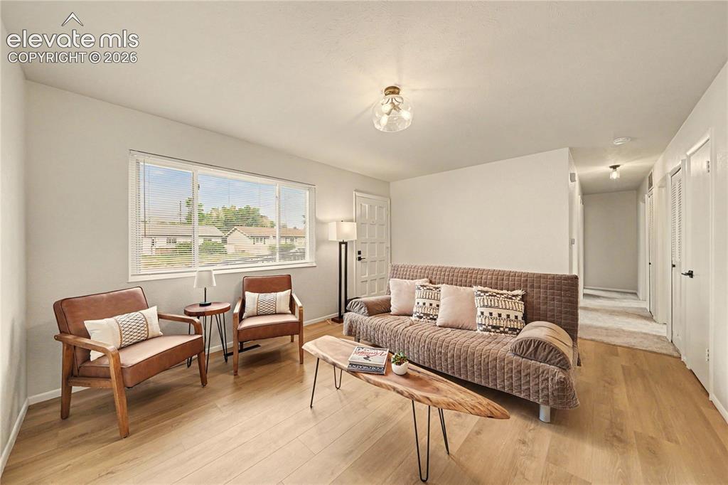 Image 5 of 18: New Laminate flooring, New paint throughout, Large window provides abundant