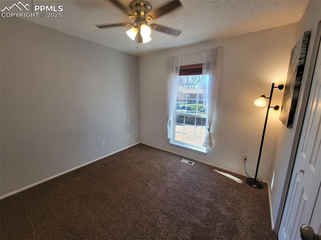 Image 22 of 43: Bedroom # 3 Main Level with Ceiling Fan