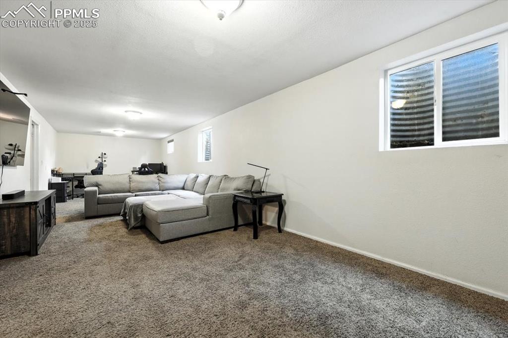 Image 25 of 43: Large Basement Family Room, great for family gatherings and TV time.