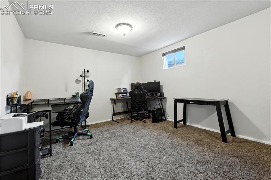 Image 26 of 43: Large Basement Family Room with plenty of space for a home office area