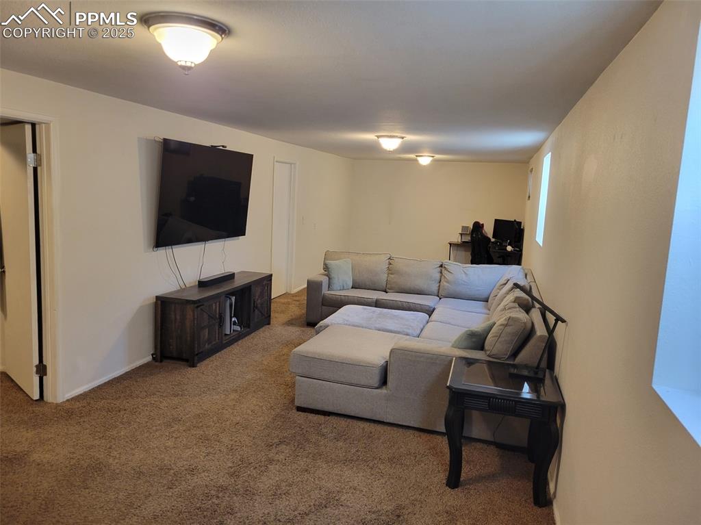 Image 29 of 43: View of carpeted living area