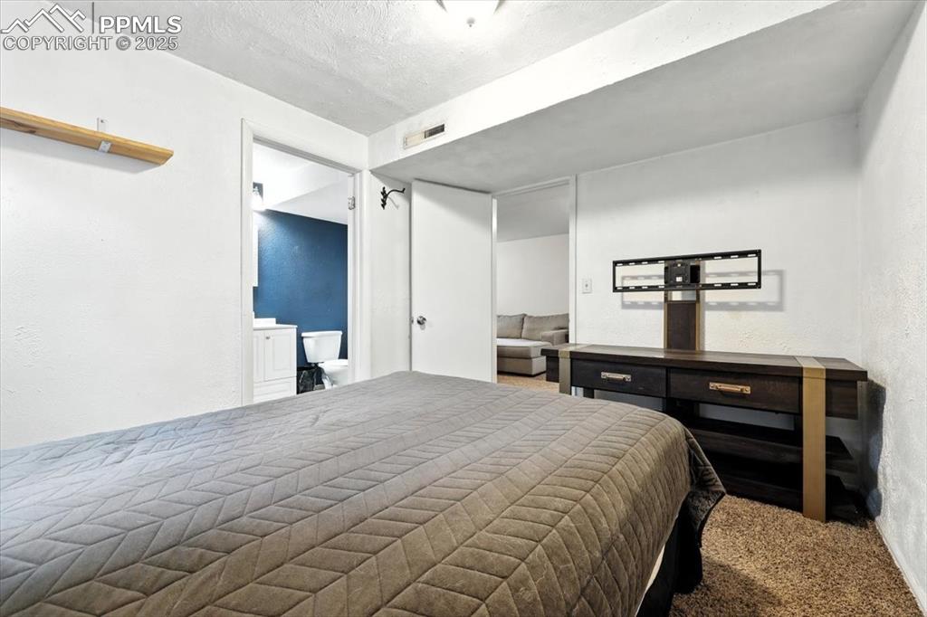 Image 32 of 43: Basement Bedroom #4 with adjoining Shower Bathroom.