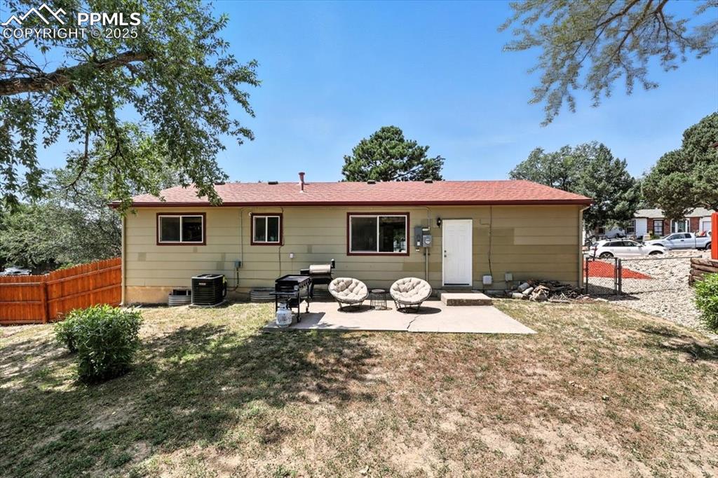 Image 36 of 43: Back of property with a patio area