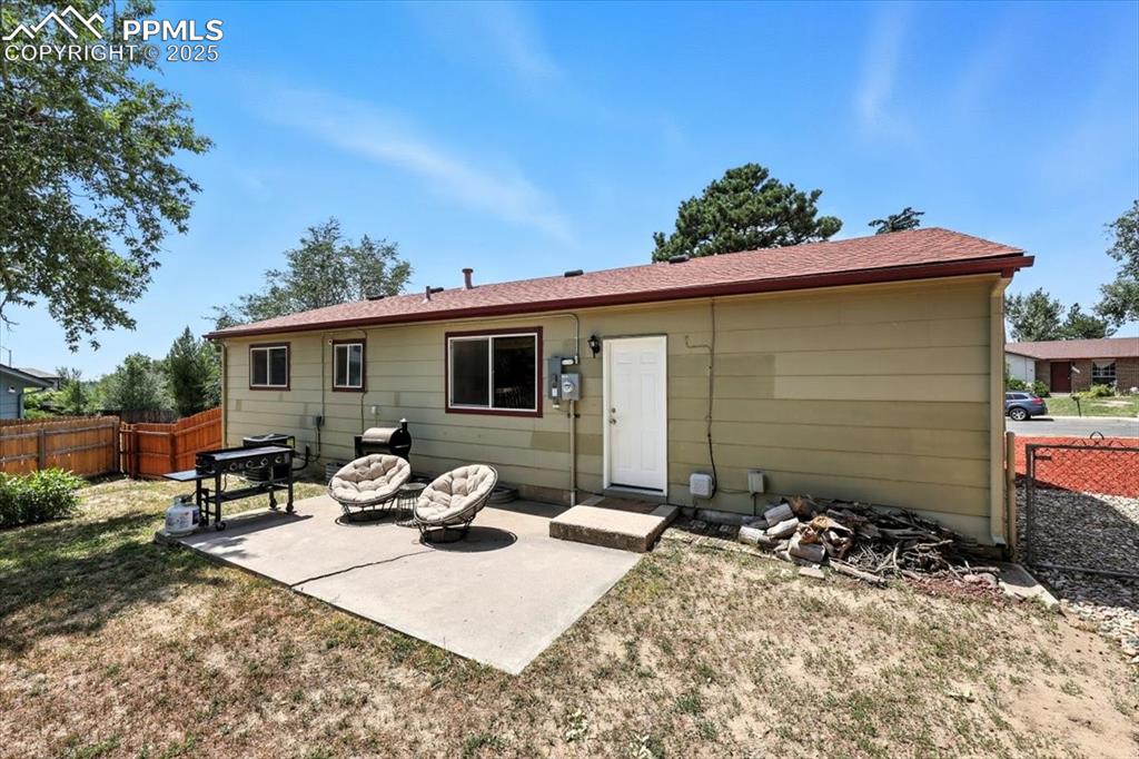 Image 37 of 43: Backyard patio for outdoor dining and relaxation.