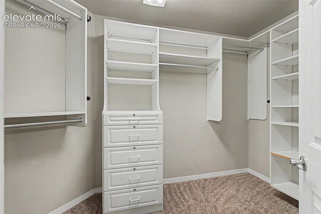 Image 32 of 50: Primary walk-in closet