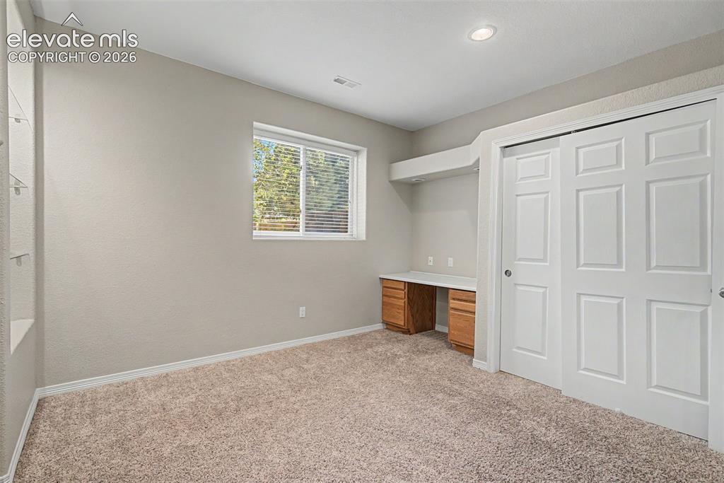 Image 45 of 50: Basement Bedroom