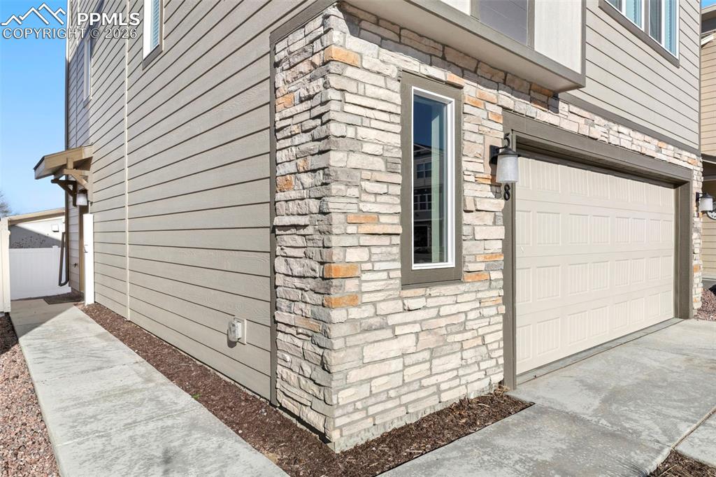 Image 3 of 35: Walkway to frontdoor.