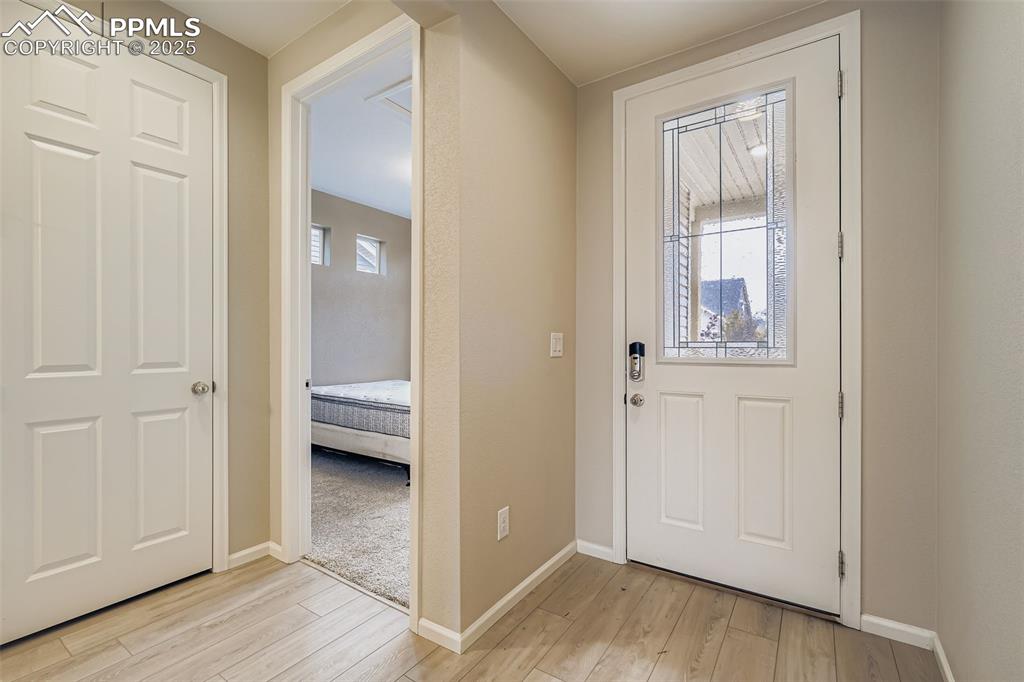 Image 11 of 28: Entrance foyer featuring light wood finished floors