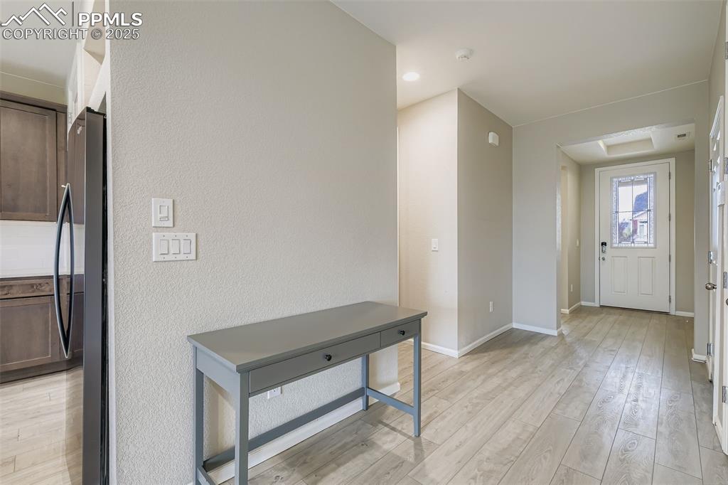 Image 22 of 28: Entrance foyer featuring light wood-style floors and baseboards