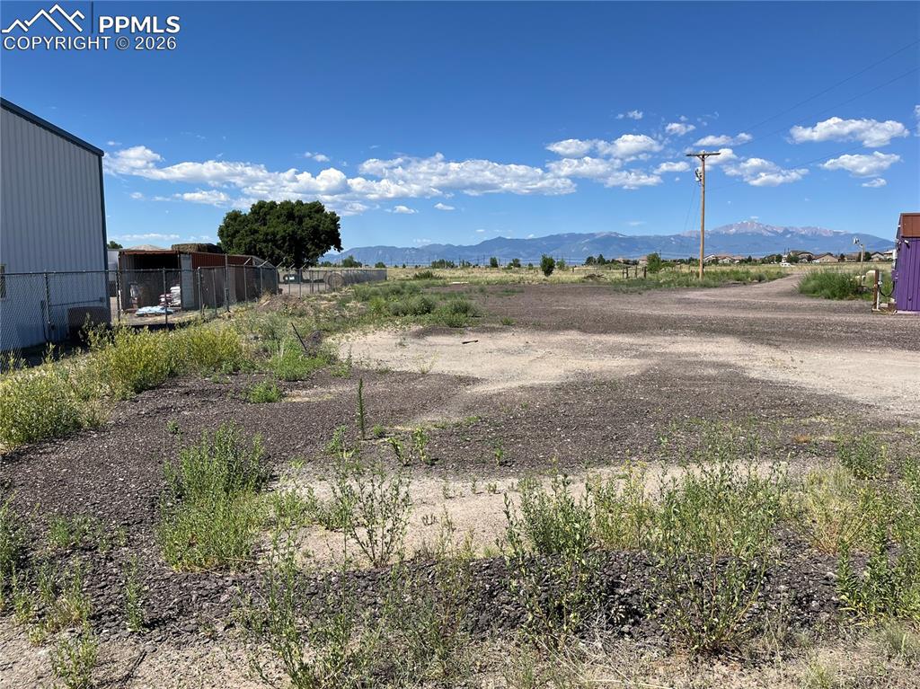 Image 11 of 20: View of yard with a mountain view and a rural view