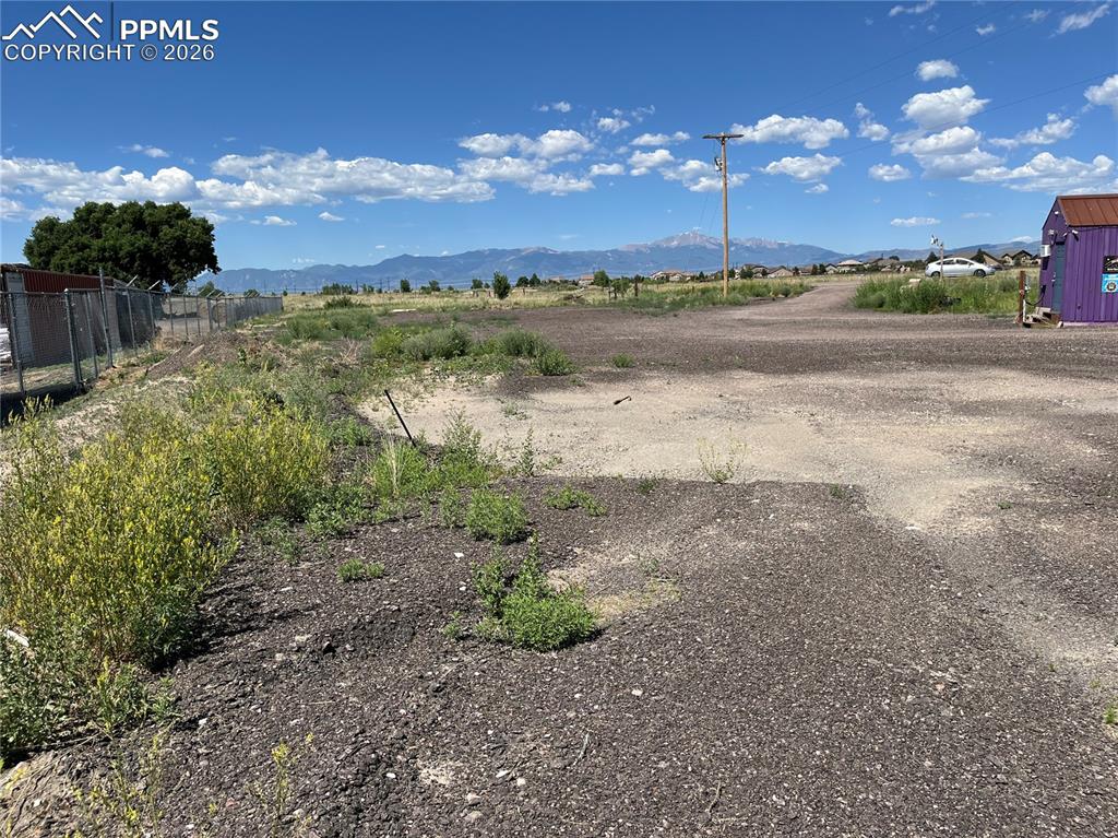 Image 13 of 20: View of yard featuring a mountain view