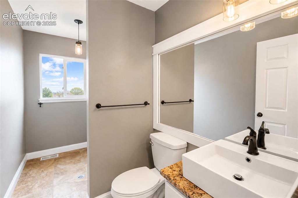 Image 13 of 43: Half bath (1)/laundry room - main floor