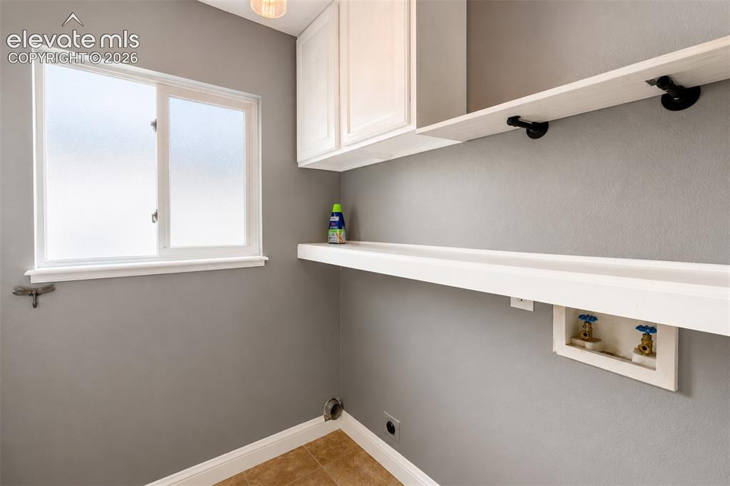 Image 14 of 43: Laundry room connected to half bath (1) - main floor