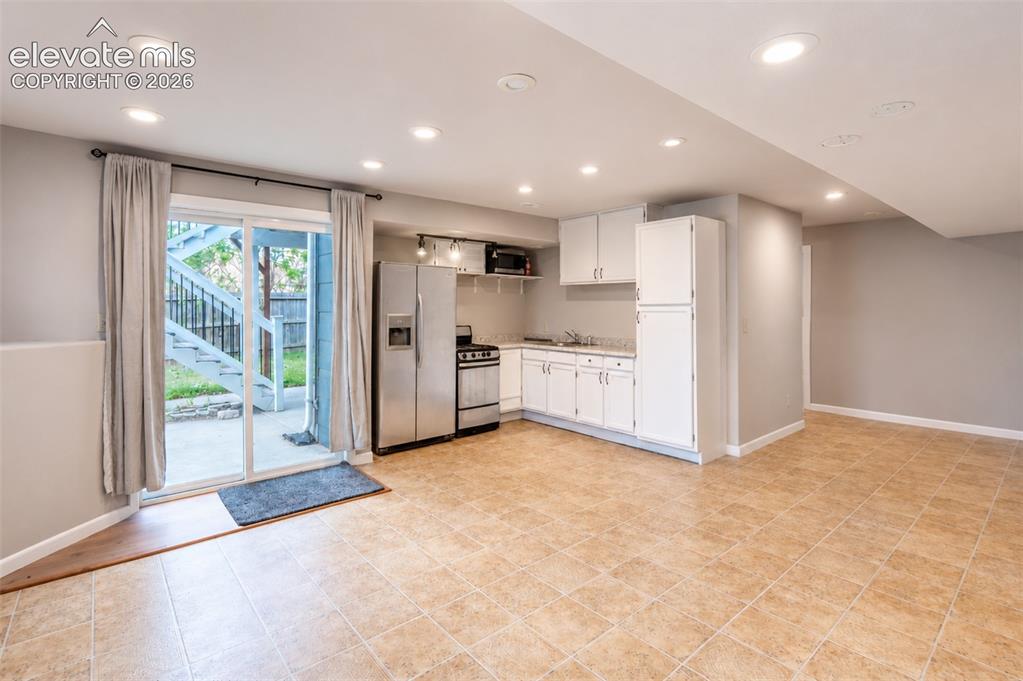 Image 27 of 43: Kitchenette with walk out - basement